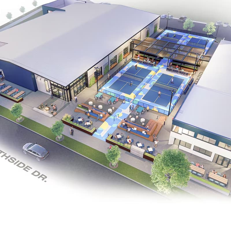 An architectural rendering of a pickleball facility exterior, showing multiple outdoor courts with colorful walkways, shaded seating areas, lounge spaces, and landscaped frontage along Southside Drive.